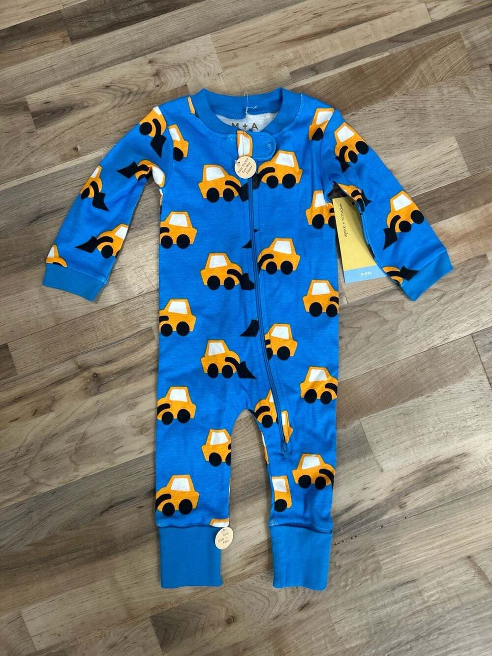 Monica + Andy Organic Cotton Two-Way Zip Romper in Construction Trucks